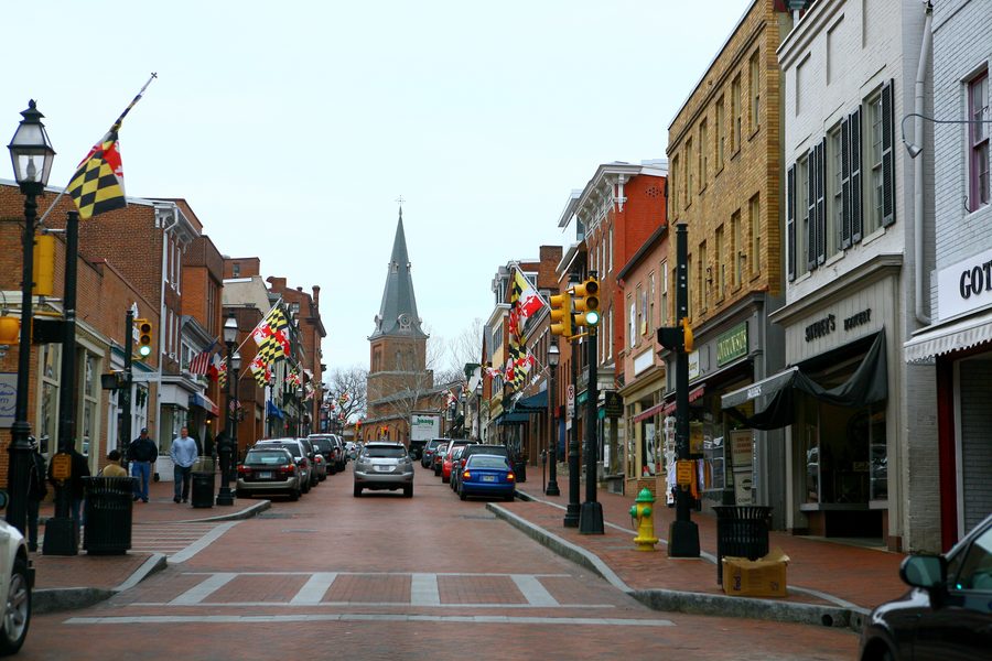 Historic Main Street in downtown Annapolis, Maryland with state flags